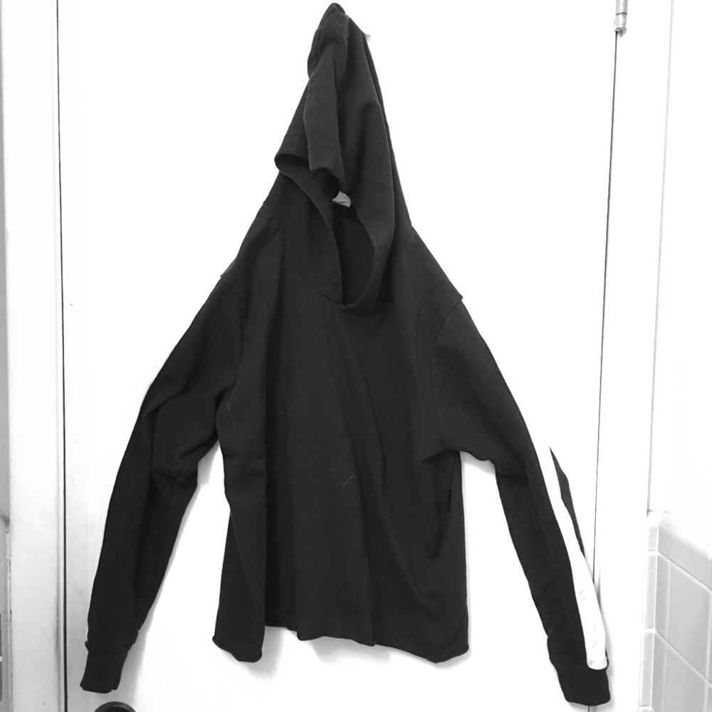 Black hoodie with white stripes on the sleeves